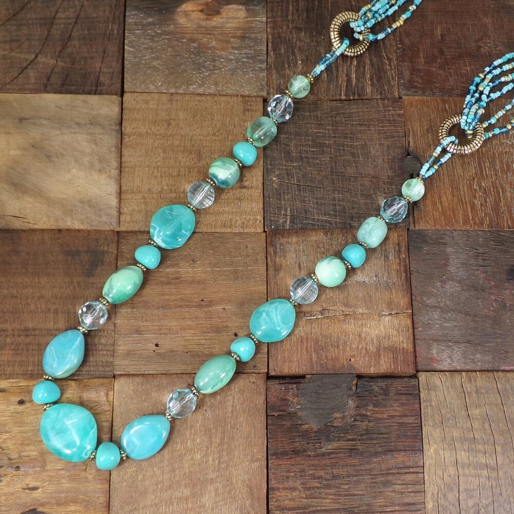 Long turquoise color bead necklace with acrylic, seed beads, and silver beads